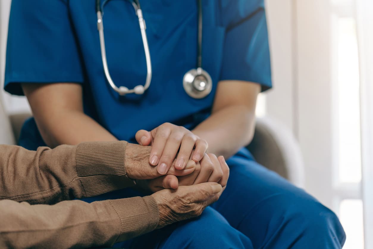 Nurse providing supportive care at home